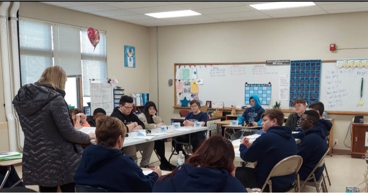 students competing in scholar bowl match  